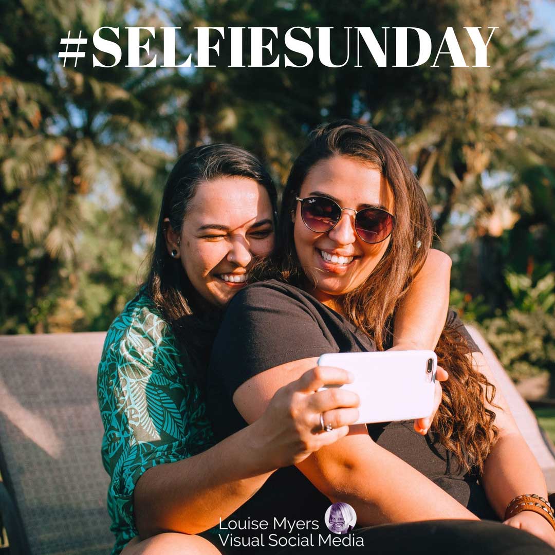 two happy women hugging as they take a selfie with hashtag selfie sunday.