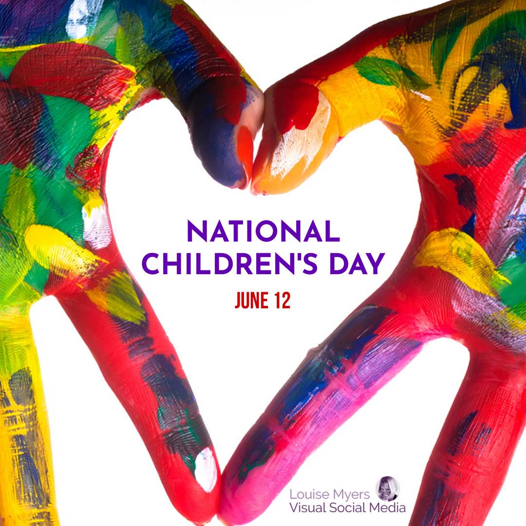 painted hands making heart shape with words National Children’s Day inside it.