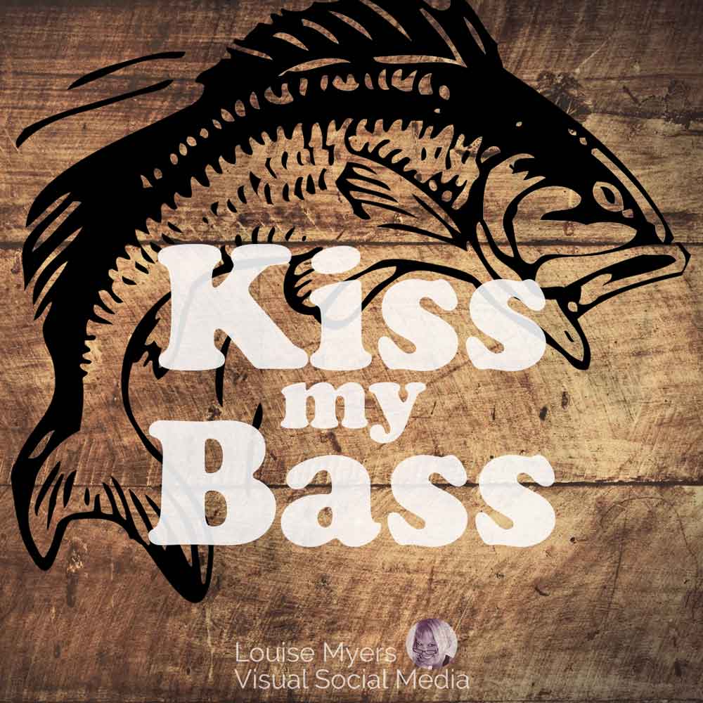 wood planks with drawing of fish says kiss my bass.