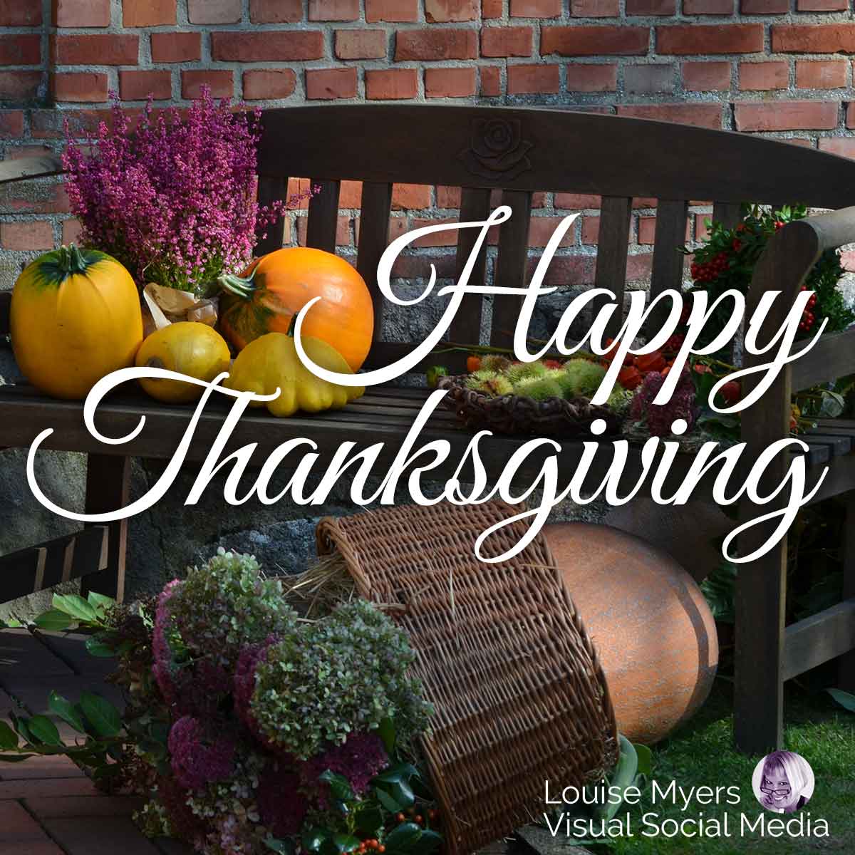 harvest of squash and veggies in large basket says happy thanksgiving.