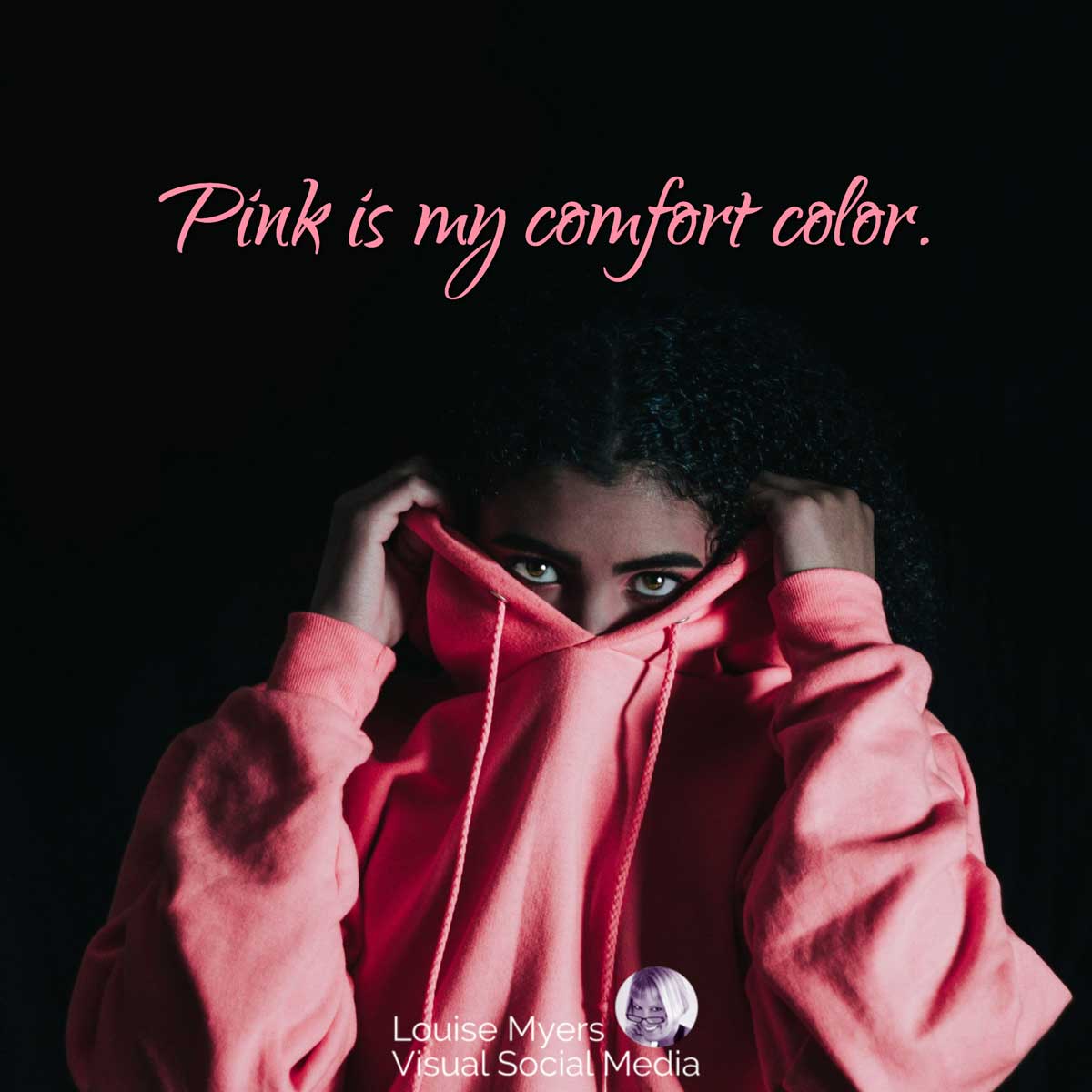 womans eyes as she pulls on pink sweatshirt with quote, Pink is my comfort color.