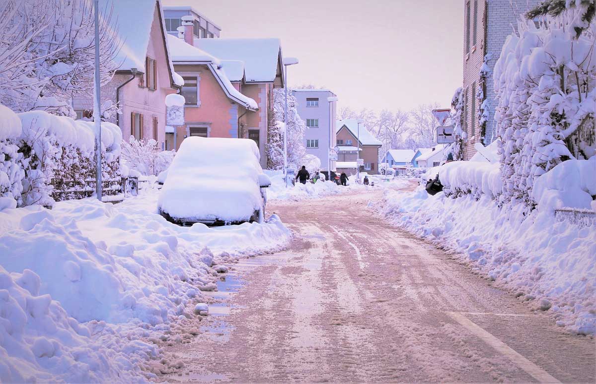 wintry snow scene in pink dawn light.