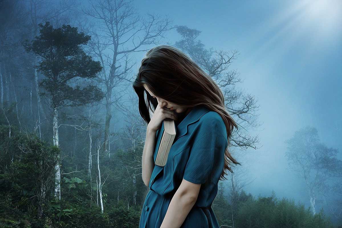 woman in dull blue scene walks with head down looking sad.