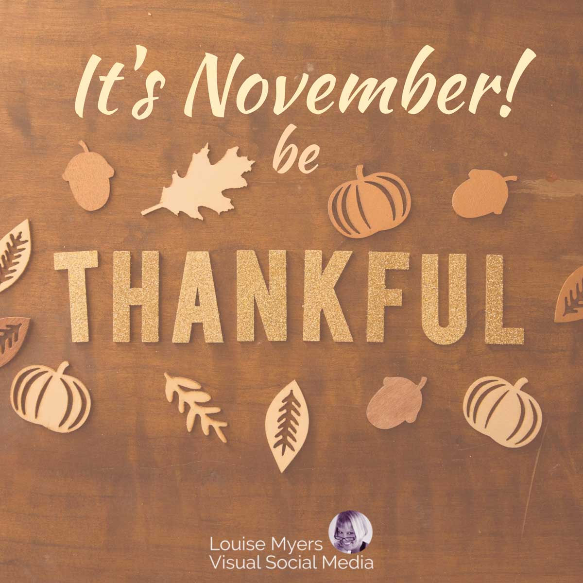 wooden cutouts on wood background says be thankful it's november.