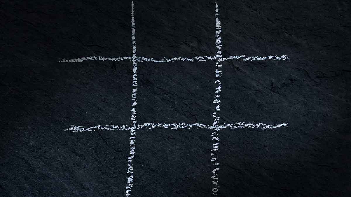 tic-tac-toe grid on chalkboard.