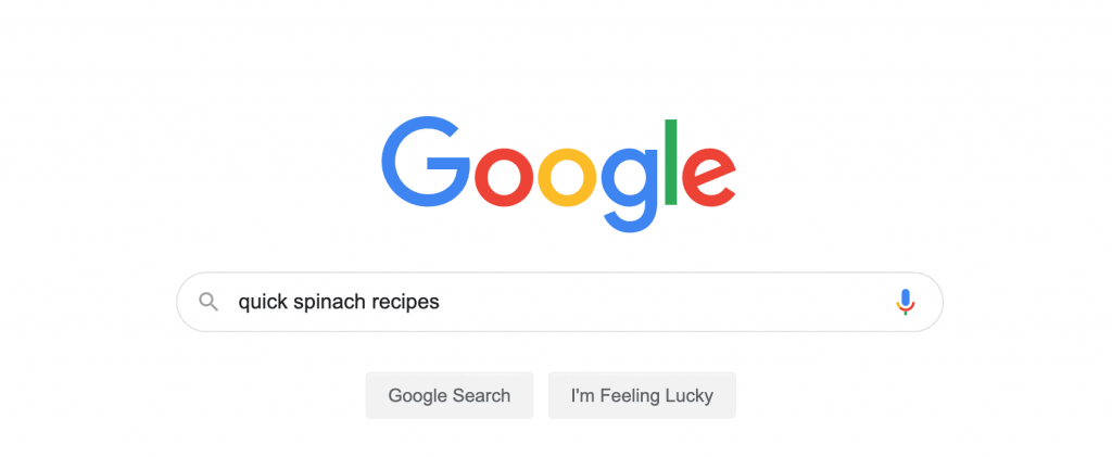 Screenshot of Google search bar with the search query quick spinach recipes in the search field